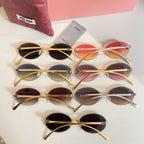 Set of MiuMiu oval sunglasses with gold-tone frames and gradient lenses