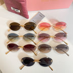 Set of MiuMiu oval sunglasses with mixed frames and gradient lenses