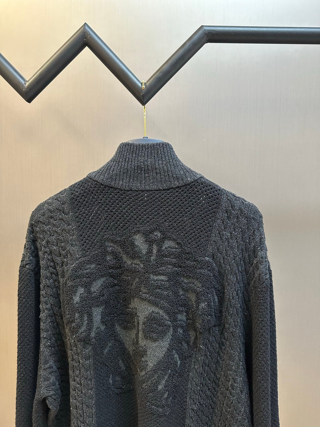 Dark knit zip-up sweater back graphic detail