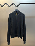 Dark knit zip-up sweater with mock neck and gold-toned zipper