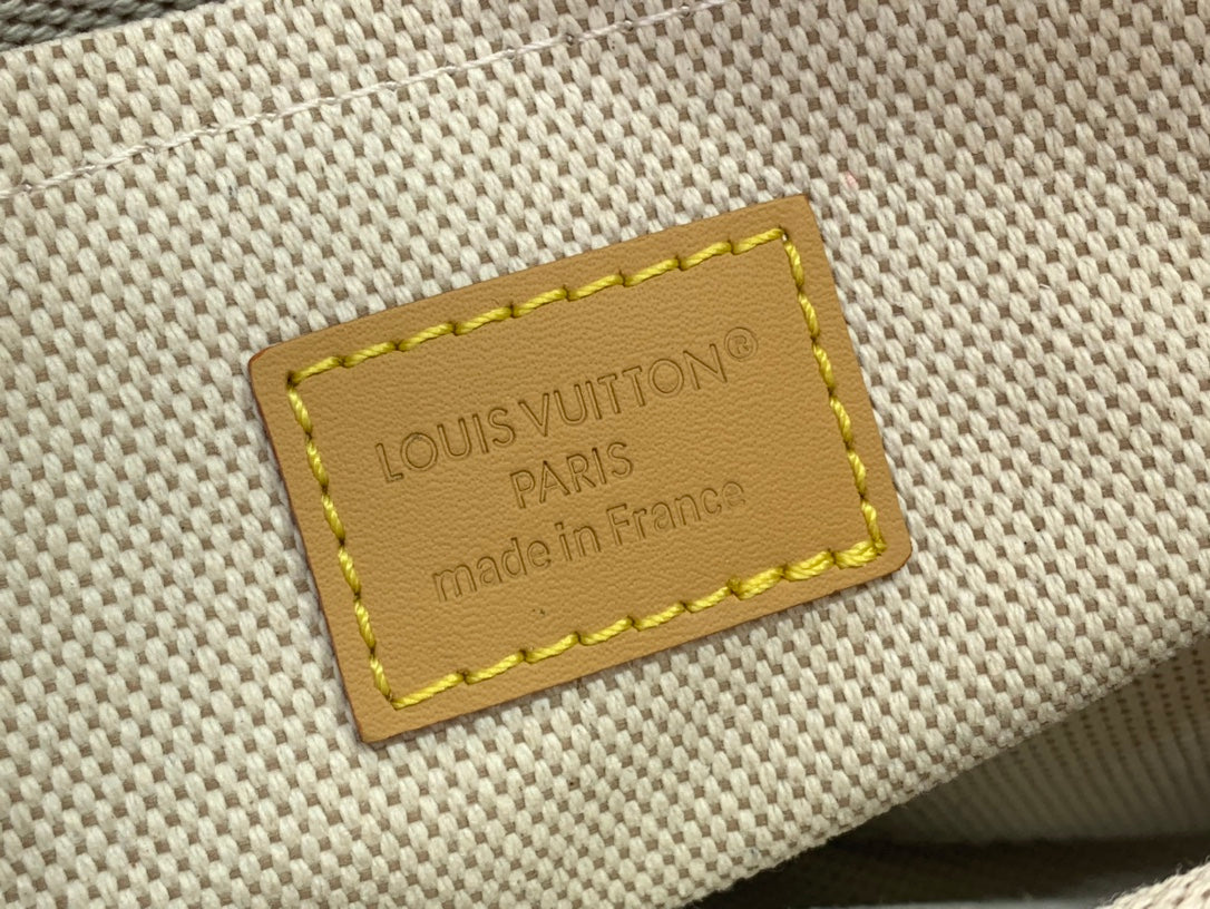 Orange fabric label with Louis Vuitton Paris and made in France text