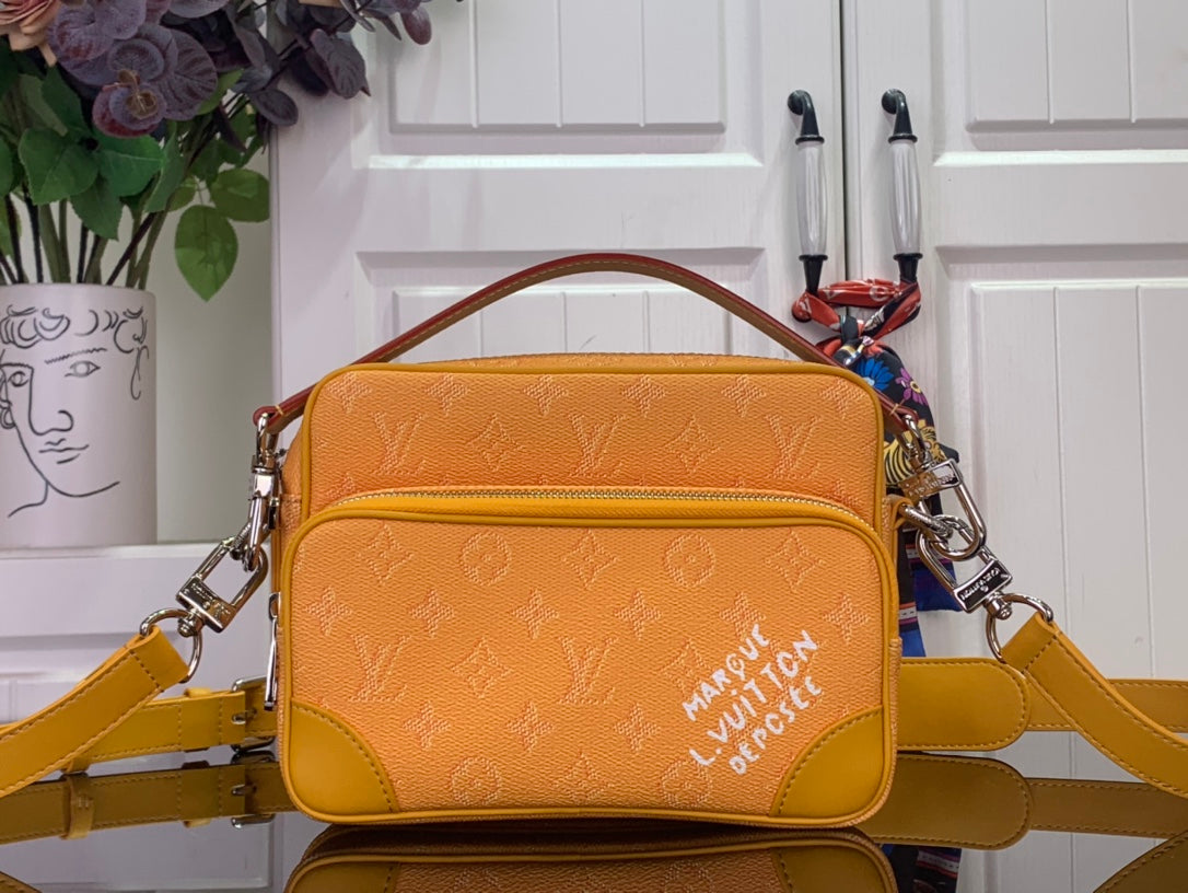 Men's Louis Vuitton crossbody bag, orange monogram with top handle and shoulder strap