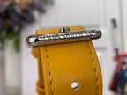 Louis Vuitton orange bag front with engraved clasp and stitched leather edge