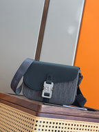 Dior bag with flap closure, silver buckle clasp, and crossbody strap in dark blue