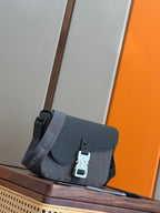 Dior men’s crossbody bag with flap front, silver clasp hardware, and logo strap