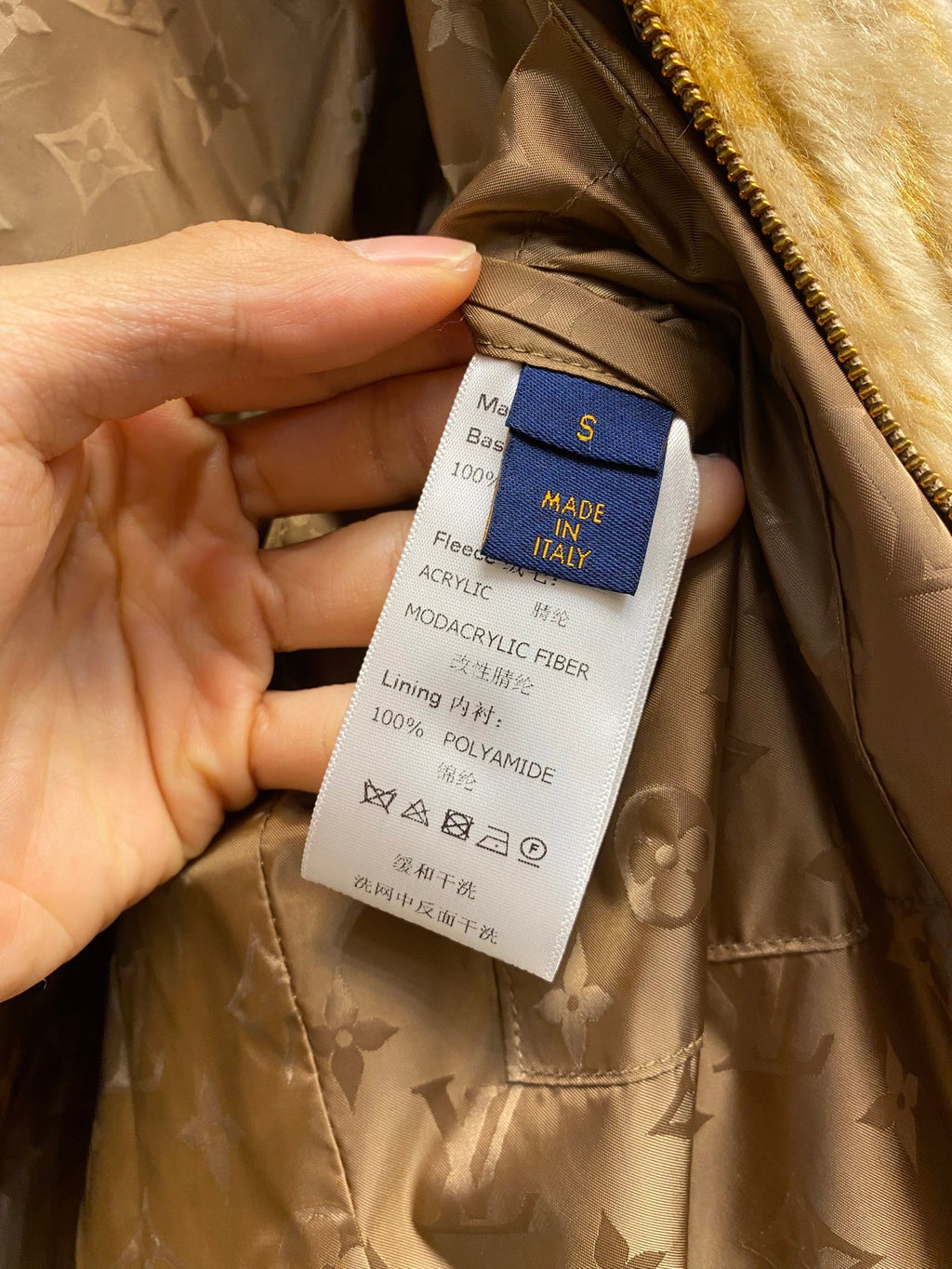 Inner fabric label on fur jacket: acrylic and polyester, size S