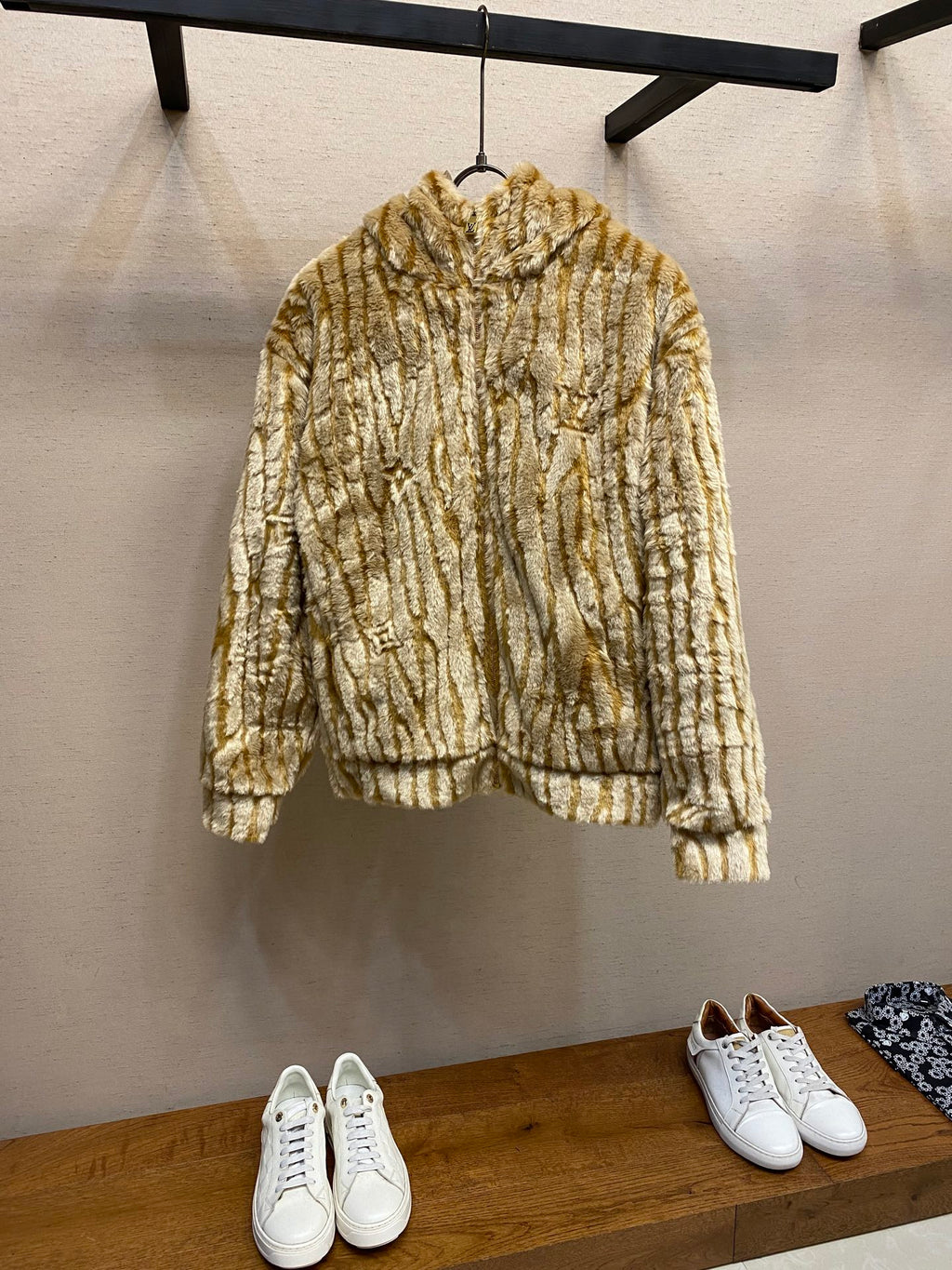 Gold-and-cream striped hooded fur jacket with ribbed cuffs and hem