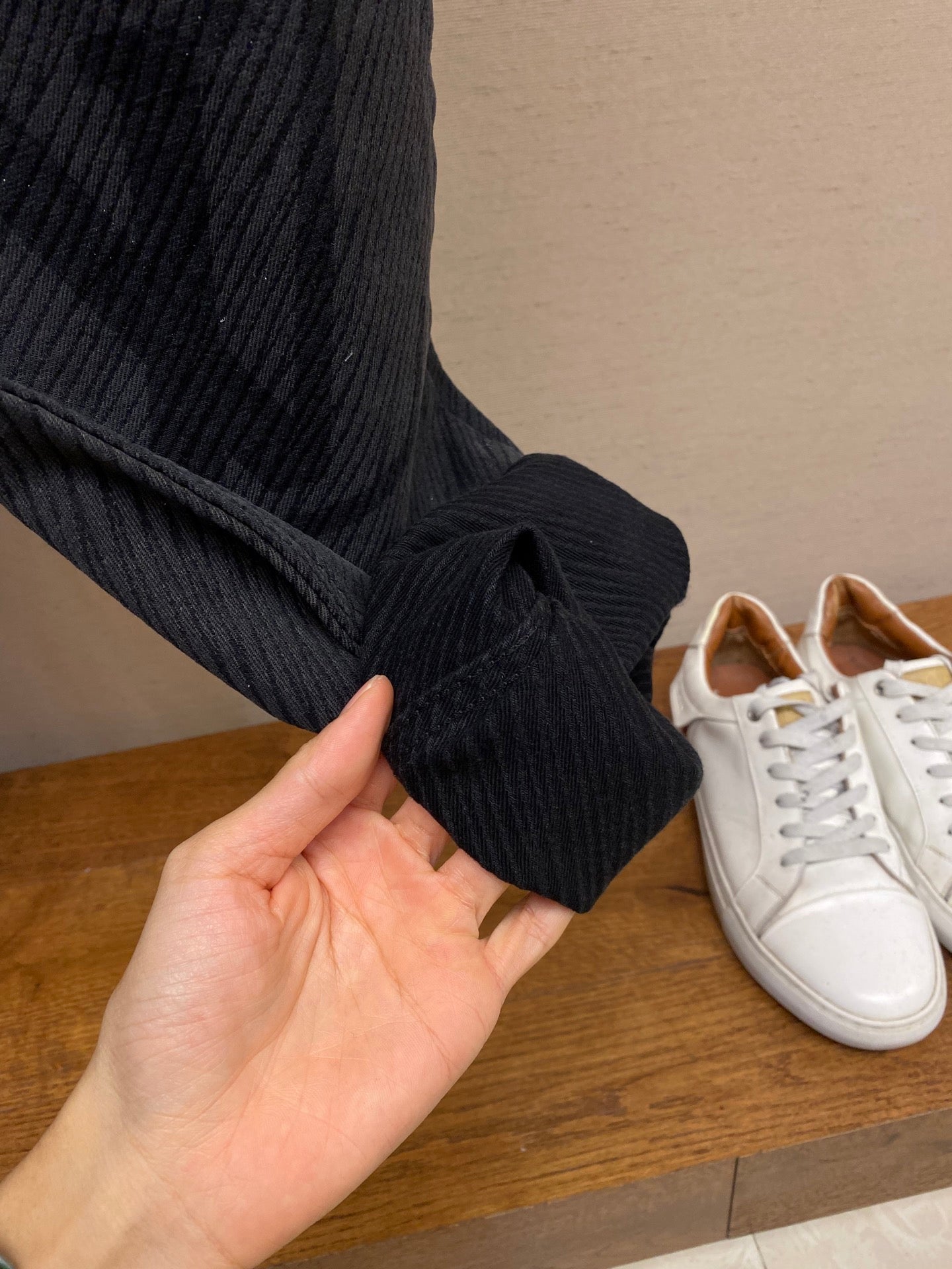 Louis Vuitton dark pants cuff detail with tied fabric hem