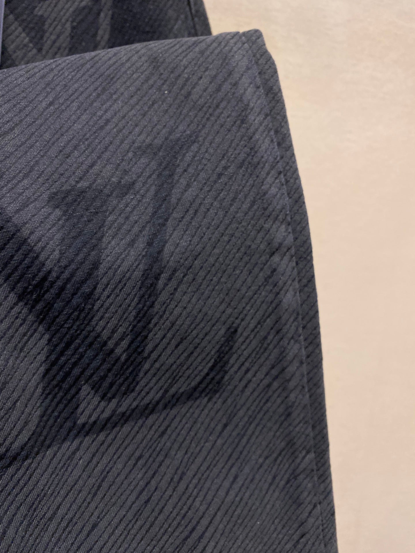 Louis Vuitton dark pants textured denim fabric close-up