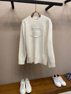Cream long-sleeve knit sweater with PRADA chain logo on front, crew neckline