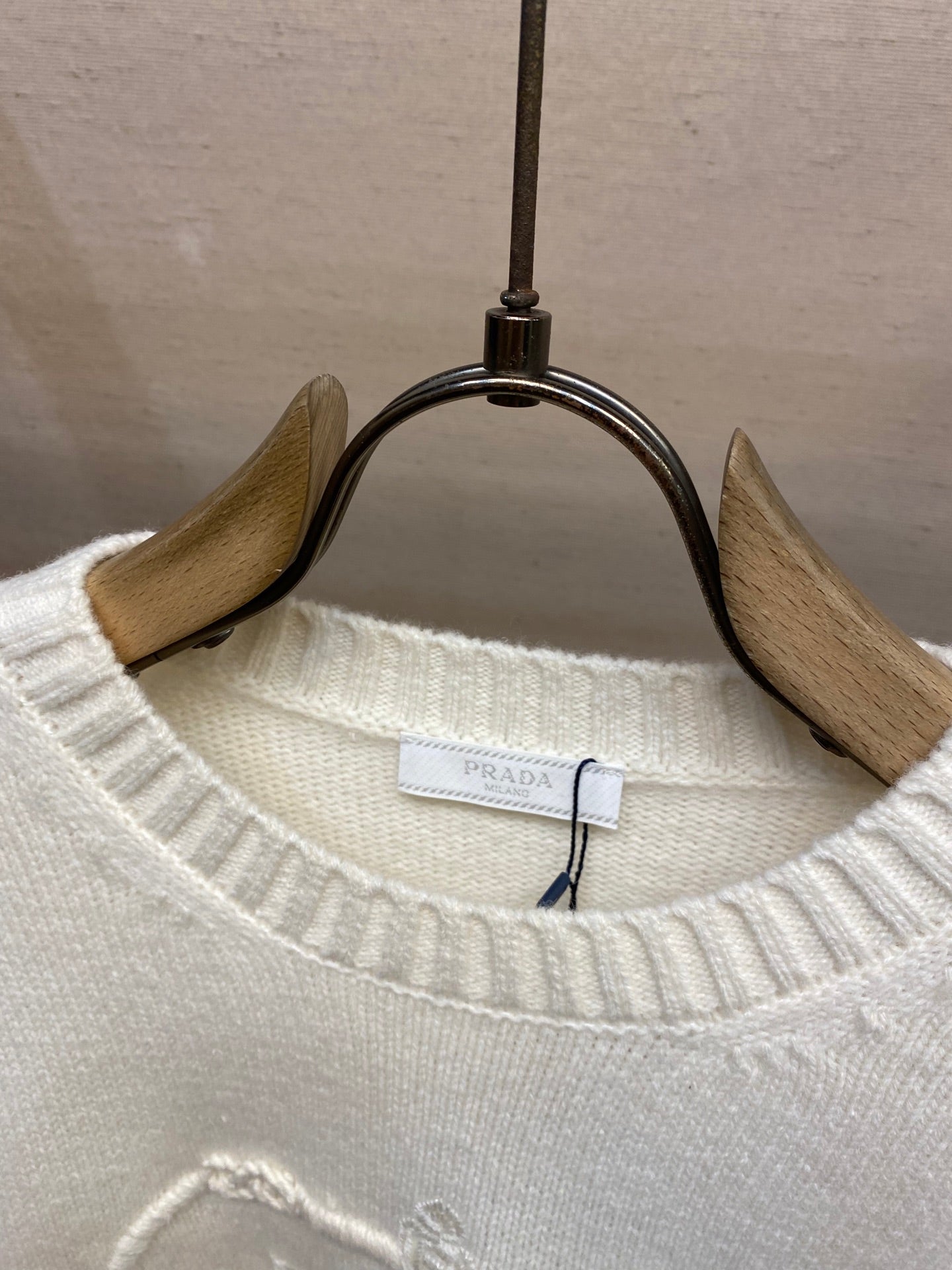 Cream knit crew neckline with PRADA label and ribbed collar detail
