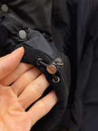 Black puffer jacket cuff with Prada logo eyelet cords