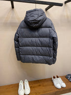 Long hooded puffer jacket in dark gray, back view