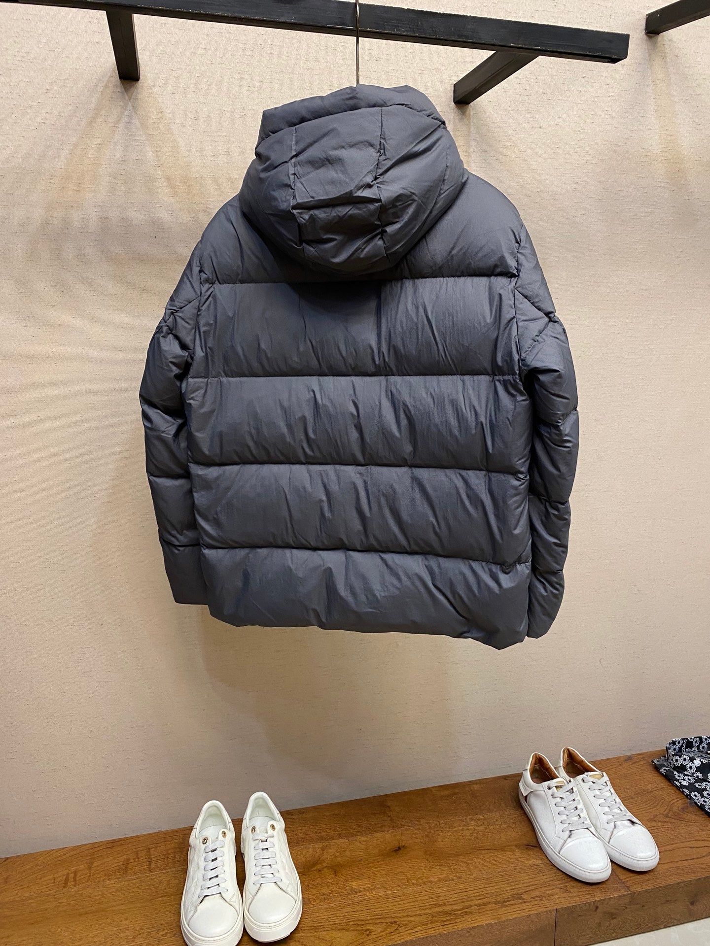 Long hooded puffer jacket in dark gray, back view