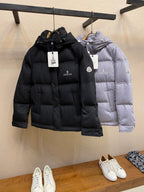 Moncler long hooded puffer jacket, black and light gray, front views