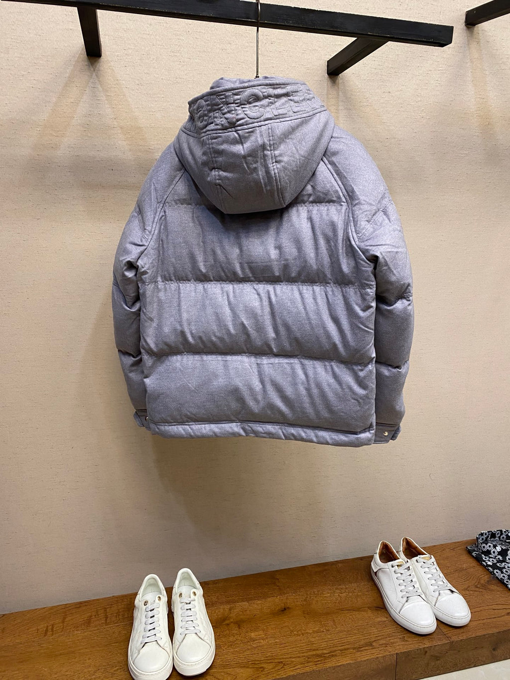 Moncler long hooded puffer jacket, light gray, back view with hood