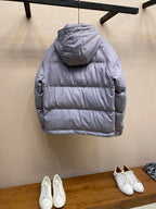Moncler long hooded puffer jacket, light gray, back view with hood