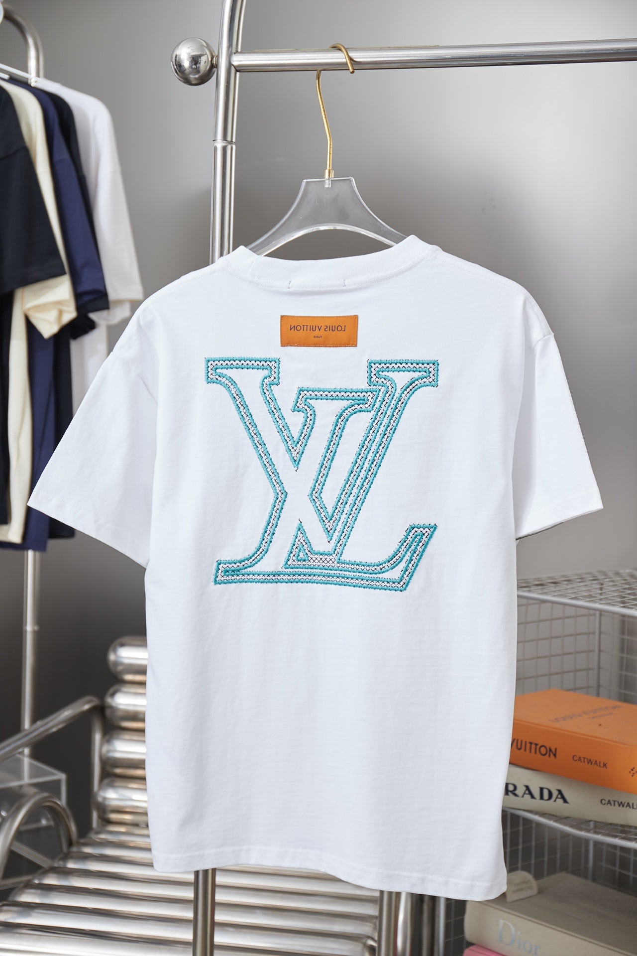 Louis Vuitton logo T-shirt in white with turquoise LV logo on back