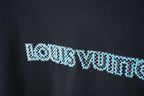 Louis Vuitton dark navy T-shirt close-up of light blue logo