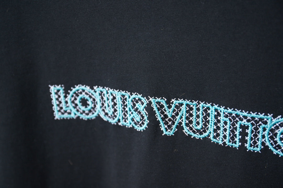 Louis Vuitton dark navy T-shirt close-up of light blue logo