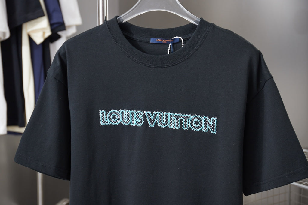 Louis Vuitton dark navy T-shirt with light blue logo across chest