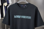 Louis Vuitton dark navy T-shirt with light blue logo across chest