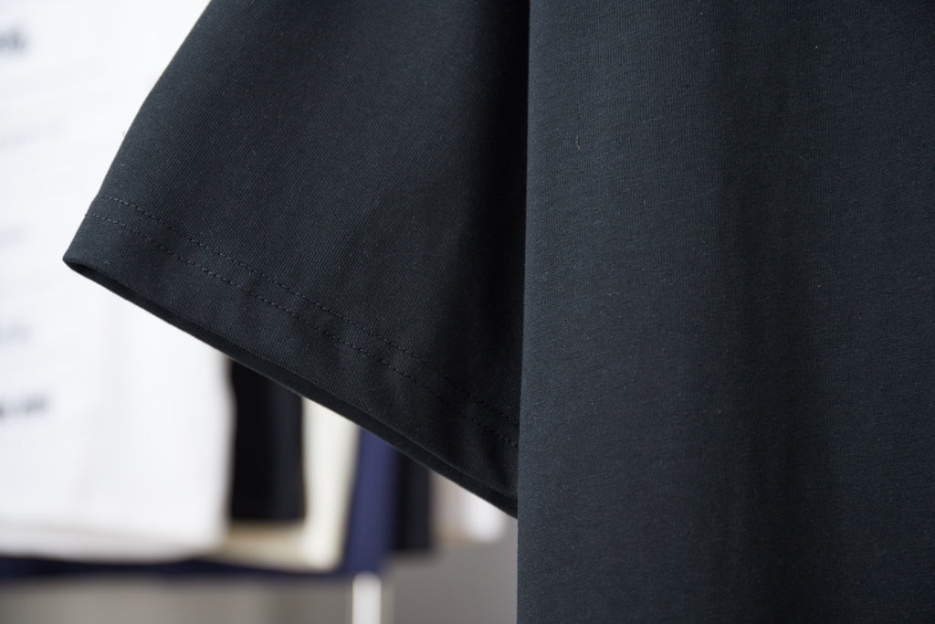 Dark short-sleeve T-shirt with stitched curved hem detail