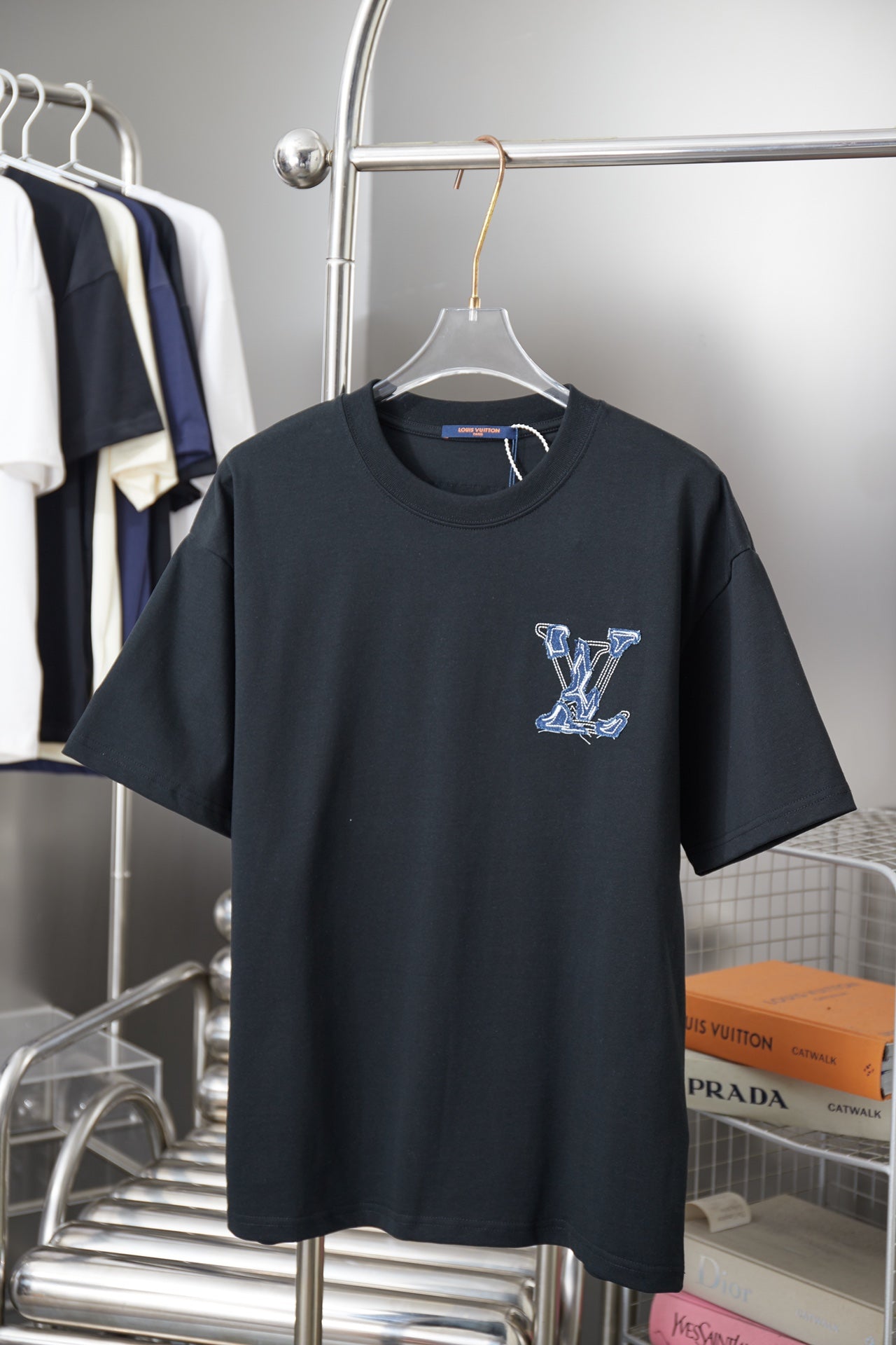 Louis Vuitton short-sleeve T-shirt in dark fabric with blue embroidered LV graphic on chest