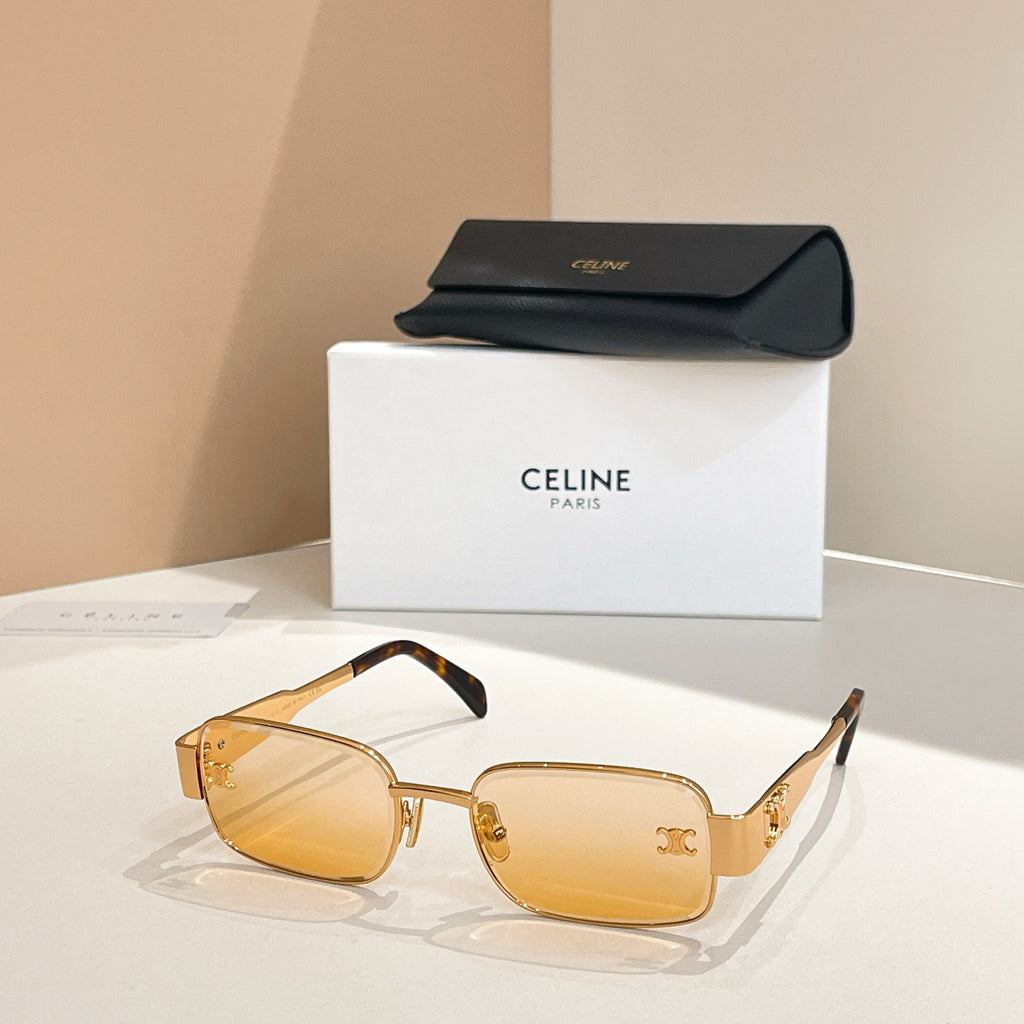Amber-tinted square sunglasses with tortoiseshell arms and gold emblem details