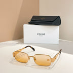 Amber-tinted square sunglasses with tortoiseshell arms and gold emblem details