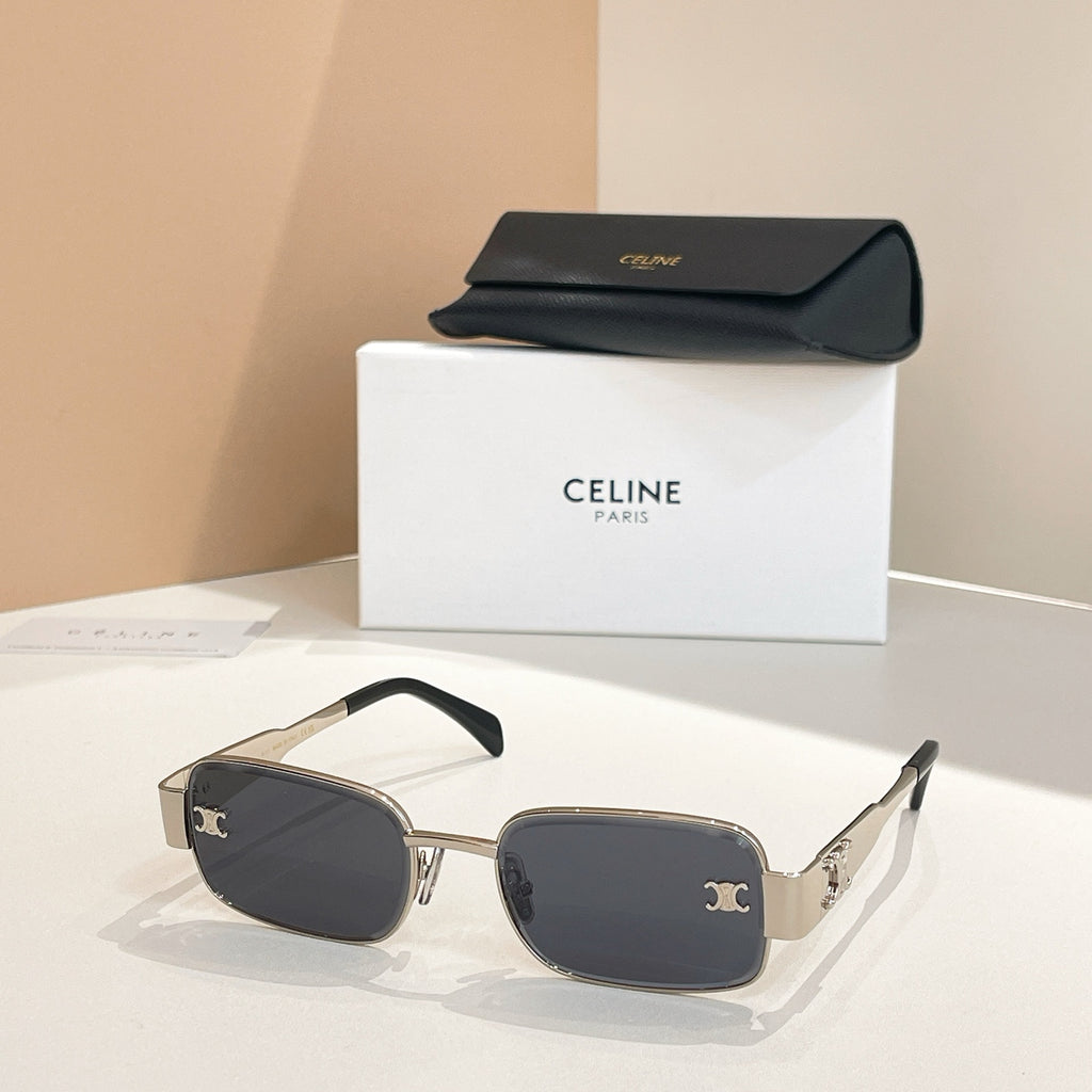 Black square sunglasses with gold-tone frames and decorative emblem detail