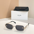 Black square sunglasses with gold-tone frames and decorative emblem detail