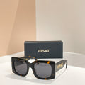 Black square sunglasses with tortoiseshell accents and dark lenses, VERSACE logo