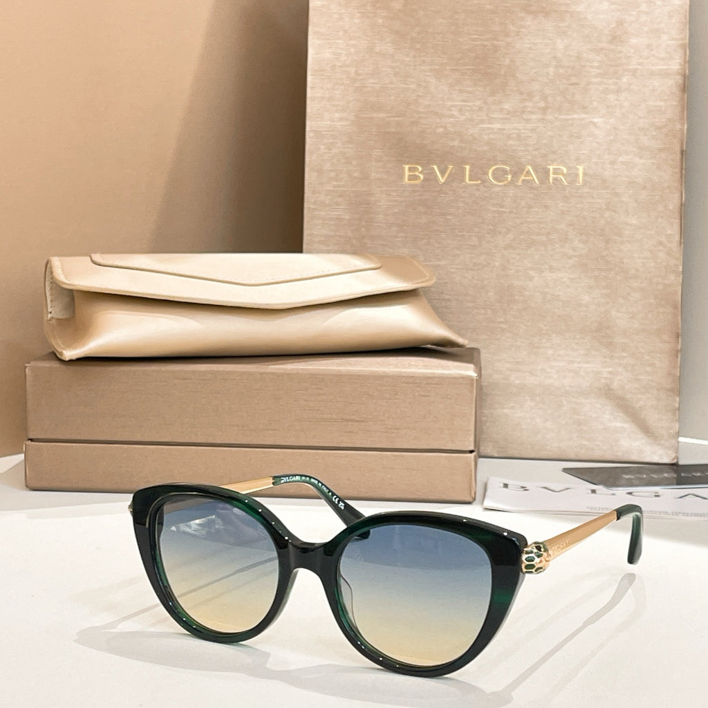 Dark green round sunglasses with gold-tone temple detail and blue-tinted lenses