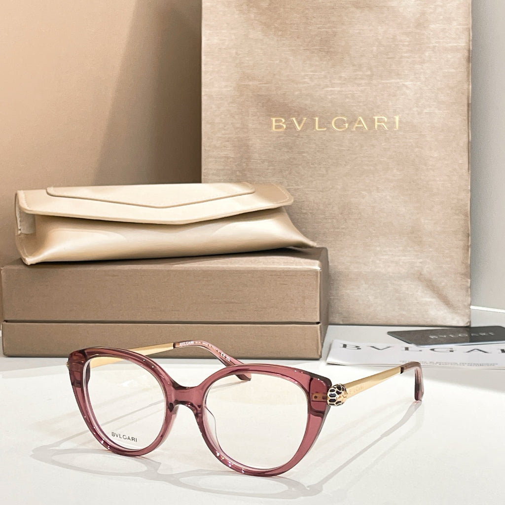 Burgundy round eyeglasses with gold-tone temple detail and clear lenses