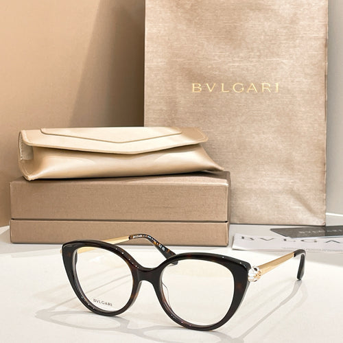Black round eyeglasses with gold-tone temple detail and clear lenses
