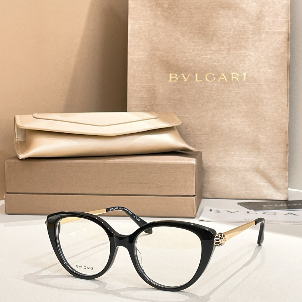 Black round eyeglasses with gold-tone temple detail