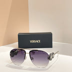 Versace sunglasses with gold frame and dark purple lenses; logo detail on temple arms