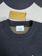 Navy sweater with ribbed crew neck and Burberry logo label at neckline