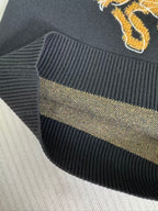 Navy sweater ribbed knit hem with gold logo stripe detail