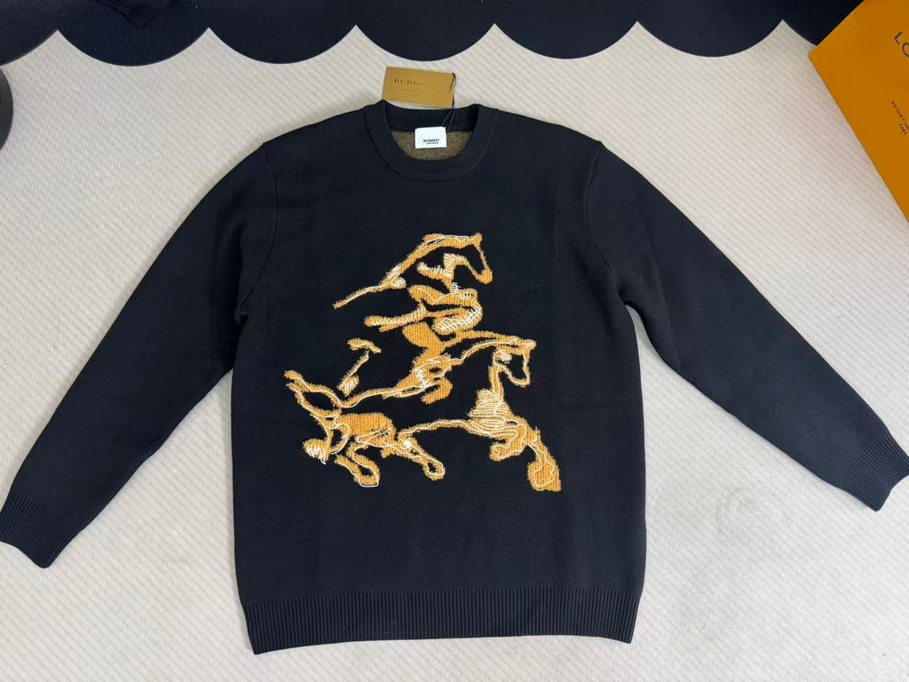 Navy long-sleeve sweater with gold horse crest graphic on the front