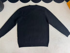 Navy long-sleeve sweater back view with ribbed hem and cuffs