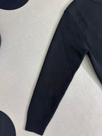 Navy long-sleeve sweater side view with ribbed cuffs and hem