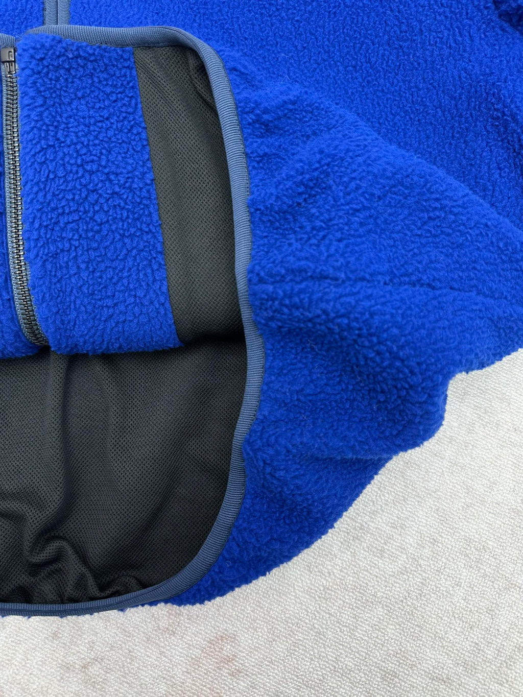 Givenchy blue fleece jacket with gray interior lining panel