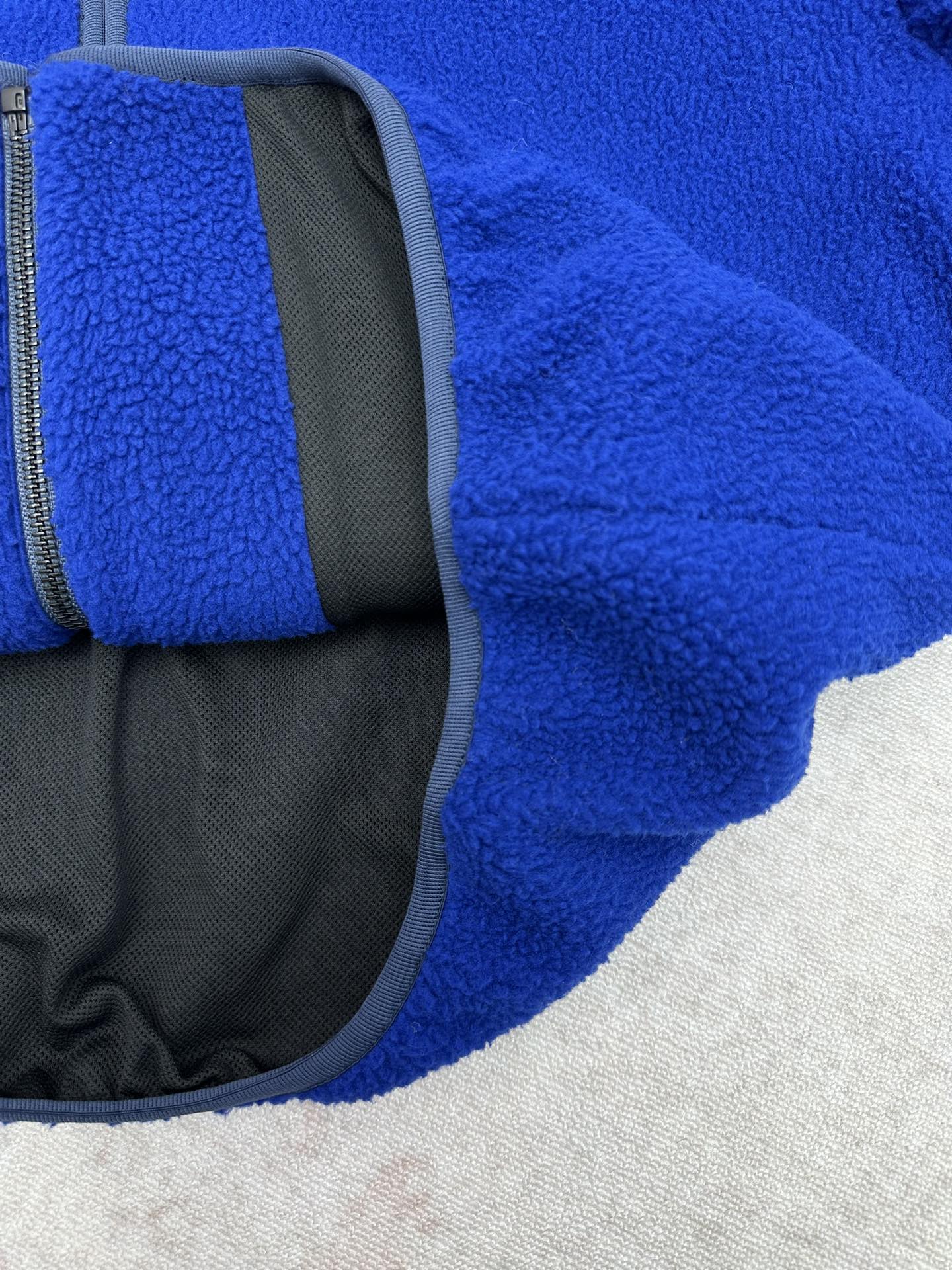Givenchy blue fleece jacket with gray interior lining panel