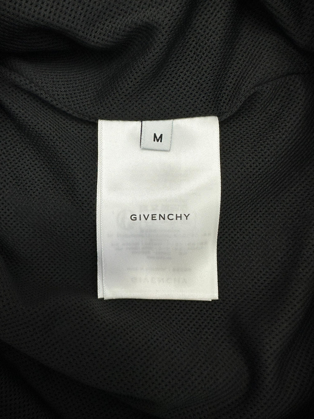 Givenchy size M inner neck label on dark lining