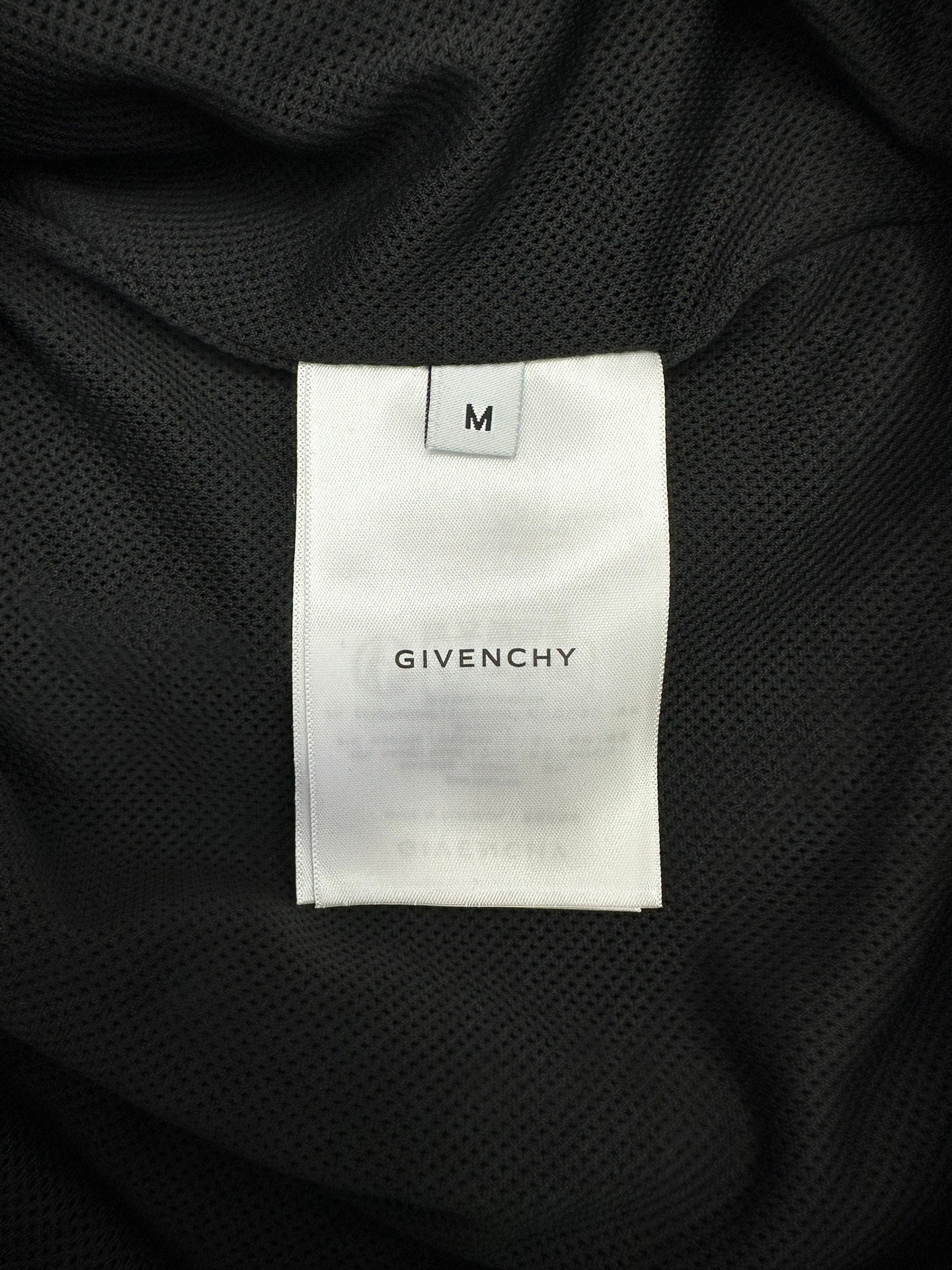 Givenchy size M inner neck label on dark lining