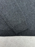 Gucci dark charcoal knit fabric texture on sleeve