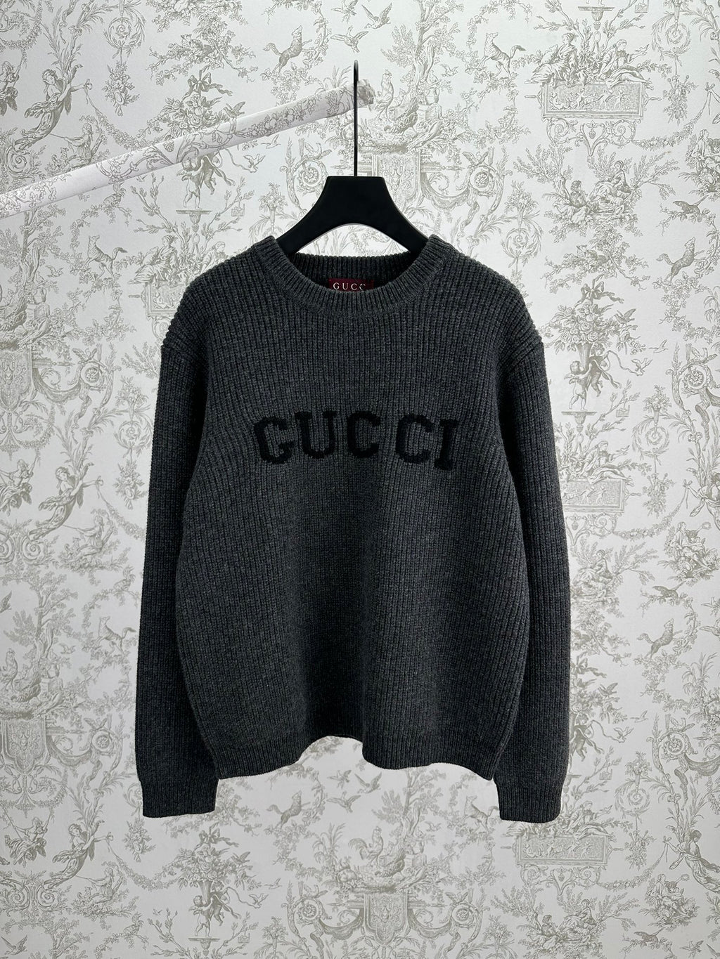 Gucci dark charcoal knit sweater with GUCCI logo on front