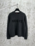 Gucci dark charcoal knit sweater with GUCCI logo on front